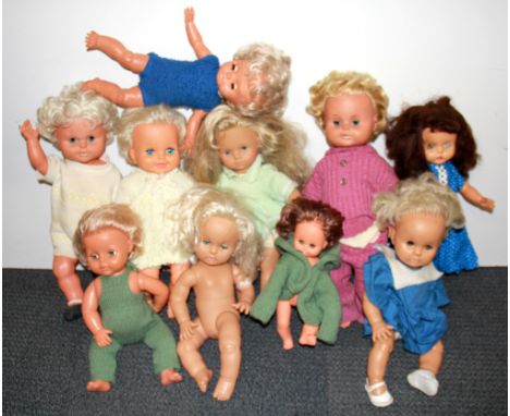 A group of vintage dolls.