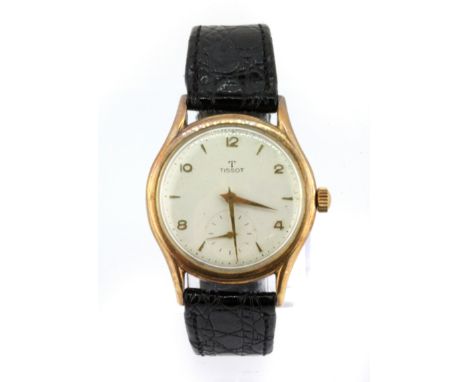 A gentleman's 14ct yellow gold Tissot automatic wrist watch on a leather strap.