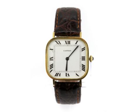 A gentleman's 18ct yellow gold Cartier manual wrist watch on a leather strap.