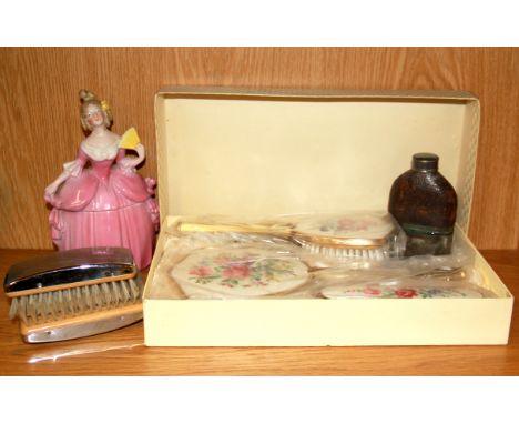 A group of dressing table items together with a hip flask.