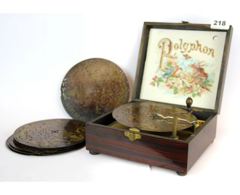 A 19th Century Manevile polyphon disk player with eight discs and original packing case - model number 28, item size 20 x 19 