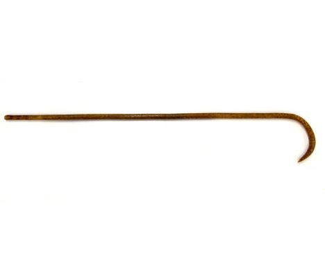 An elaborately decorated walking stick, signed on the handle, L. 99cm.