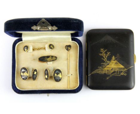 A Japanese silver and gold decorated cigarette case together with matching cufflinks, tie clip and stick pin, cigarette case 