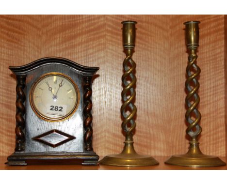An oak cased mantel clock together with a pair of open barley twist brass candlesticks, Clock H. 22cm.