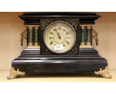 A 19th Century wooden mantle clock, H. 29cm.