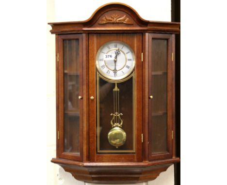 A wall mounted clock display cabinet, size 51 x 59cm.