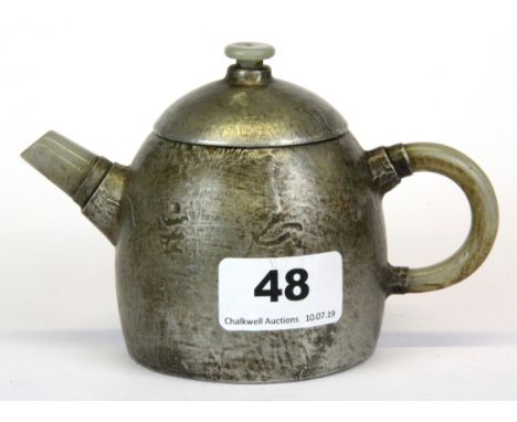 A Chinese pewter decorated terracotta teapot with jade spout and handle, H. 9.5cm.