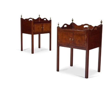 A PAIR OF MAHOGANY BEDSIDE TABLES IN GEORGE III STYLE 20TH CENTURY With brass urn finials to each corner of the tray-top,  Ea
