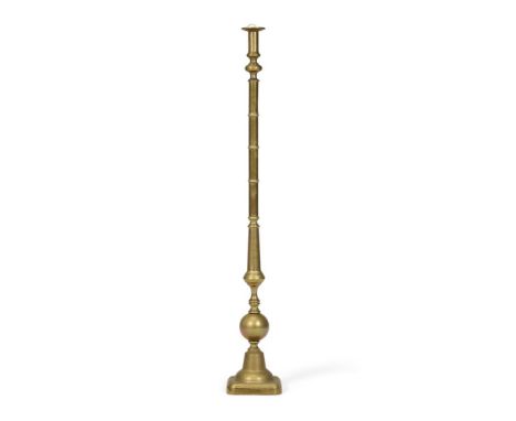 A BRASS STANDARD LAMP BASE  EARLY 20TH CENTURY, IN THE DUTCH 18TH CENTURY MANNER In the form of an oversized candlestick with
