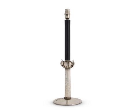 AN ARTS & CRAFTS SILVER PLATED CANDLESTICK  CIRCA 1905  With later ebonised faux candle above the tulip form sconce and plani