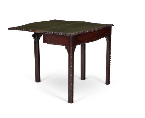 A GEORGE III MAHOGANY CARD TABLE  CIRCA 1760 The serpentine top with egg and dart moulded edge folding to reveal a baize line