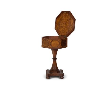 A GEORGE IV POLLARD OAK TEAPOY  CIRCA 1830  Of octagonal section the hinged top enclosing a vacant interior, on a facetted st