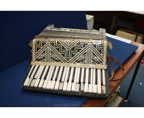 A Wurlitzer Accordion, working but a/f.
