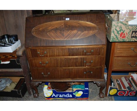 A reproduction Georgian style Bureau, having plain top over the leather lined fall with oval moulded panel front, opening to 