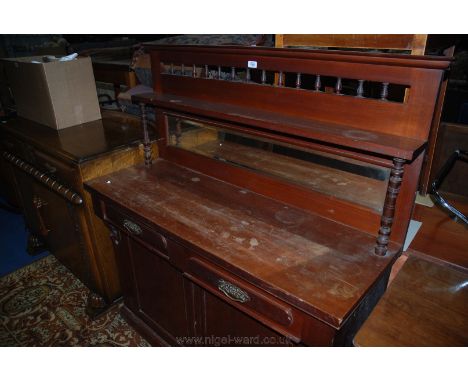 A Victorian Mahogany Chiffonier, having moulded top upstand back with spindle turned top rail supports, over shelf on turned 