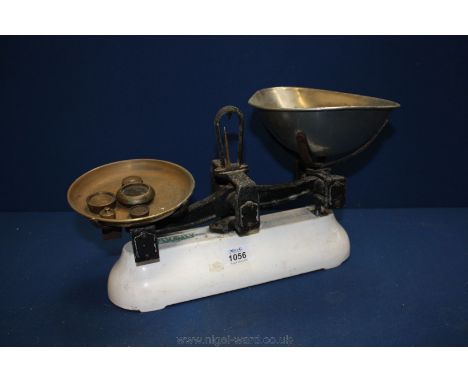 An Avery Kitchen Scales up to 21lbs and five small weights.