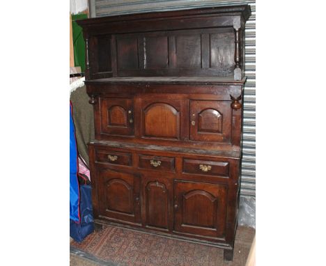 A superb circa 1730 Georgian Cwpwrdd Tridarn in three tiered sections, the top section having moulded cornice, single panel e