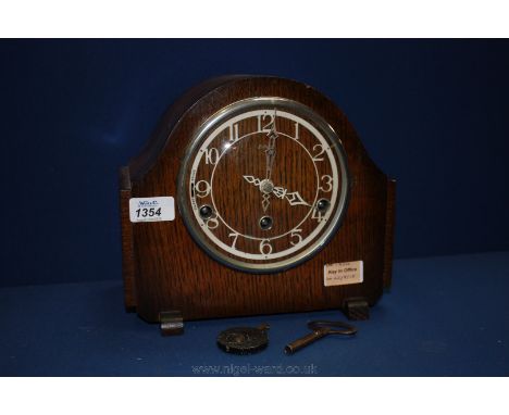 A large Enfield mantle Clock having Westminster chimes, complete with key and pendulum.
