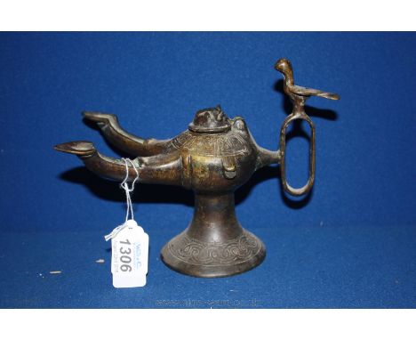 A Khorassan type twin spout oil lamp, the cover cast as the head of a cat, 5 1/2'' tall