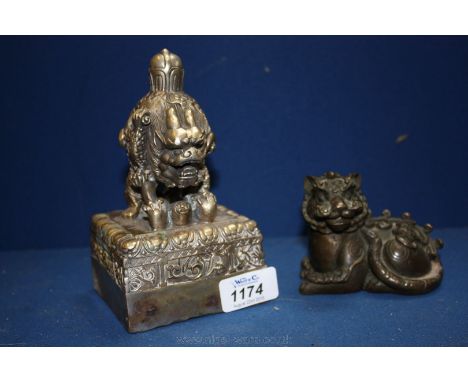 A silvered brass Chinese official Seal and a well modelled brass seated animal with lucky Bat.