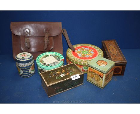 A quantity of old tins, glass lenses, bagatelle balls, old leather school satchel, etc.