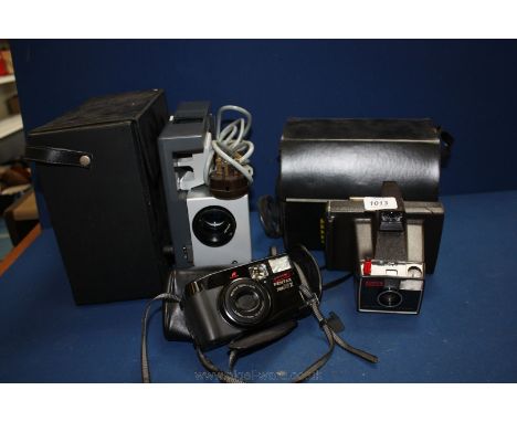 A cased Polaroid Land Super Swinger Camera with instructions and a Pentax zoom 70-x AF Camera and a cased Rollei film slide P