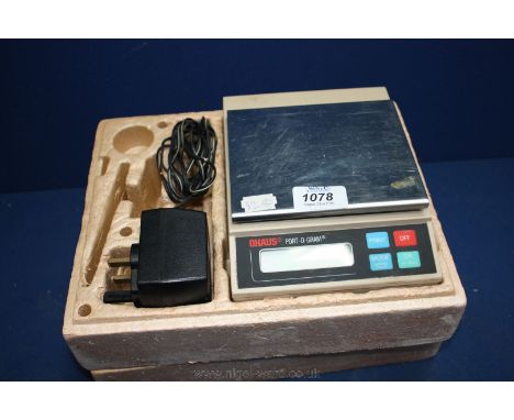 A set of Ohaus port-o-gram Electronic Scales.