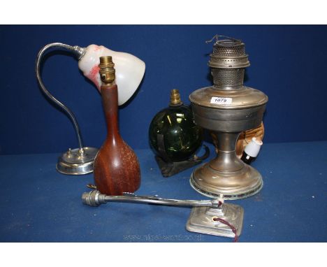 Three table Lamps, two desk Lamps and an old oil Lamp.