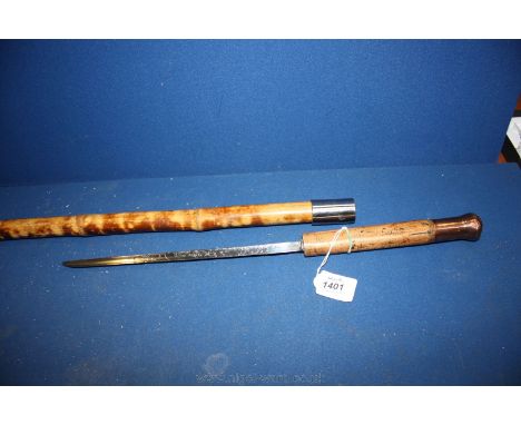 An early 20th c. Dagger Stick, the blade highly decorated, with Malacca handle, copper knob and bamboo shaft