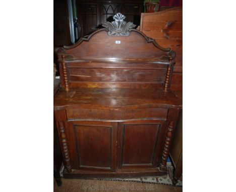 A Victorian mahogany Chiffonier , having carved chest upstand back with moulded edges, shaped shelf on bobbin turned supports