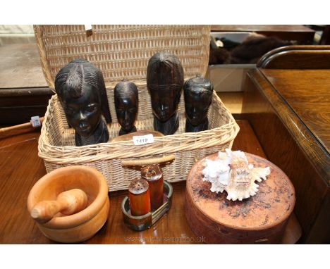 A quantity of Treen including four carved African heads, Pestle and mortar, Cruet, etc., plus a Collar Box with internal fixe