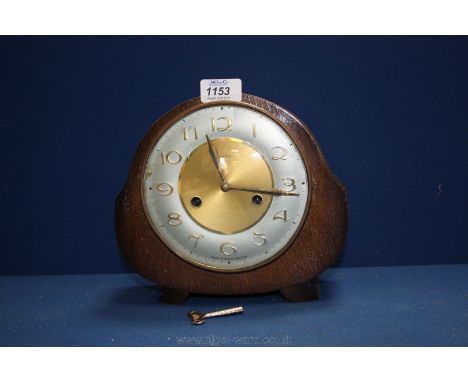 An old Smiths mantle Clock, with key.