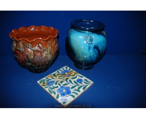 A Watcombe Jardiniere with dragon design, Southall pottery tile etc, some a/f.