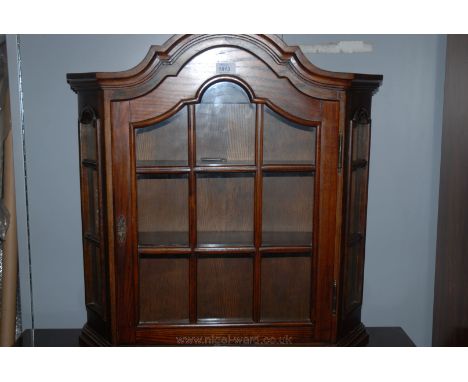 A reproduction Oak finished Dutch style wall mounted Display Cabinet, having arch top with moulded cornice over shaped top, n