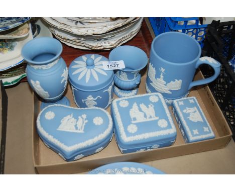 A quantity of blue Wedgwood Jasperware including tankard, pot and lid, two vases, three trinket pots etc.