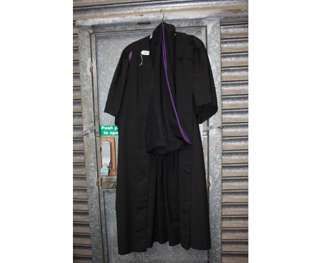 A graduation Gown and sash by Ede and Ravenscroft Ltd.
