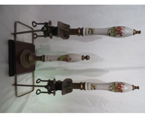 2x Vintage beer pumps, and an ornamental beer pump on wooden plinth. All with ceramic handles depicting hunting scene.