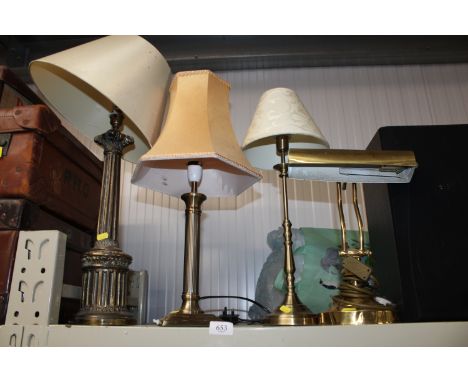 Two Corinthian column table lamps; a brass desk lamp and another table lamp