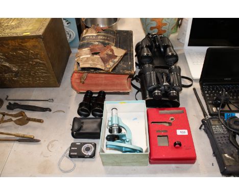 A Holy Bible, two pairs of binoculars, a Pentax camera and a students microscope