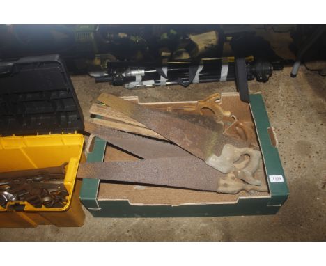 A box containing a quantity of vintage hand saws 