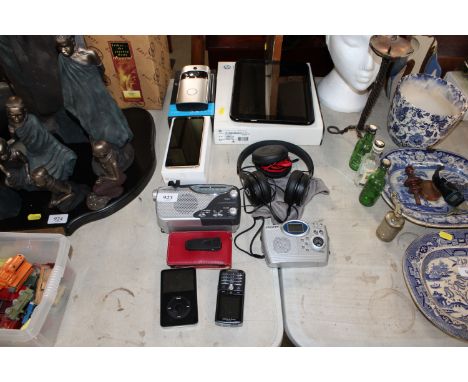 A HP Touchpad, a wireless video doorbell, a Samsung A8 mobile phone, various other phones and radios, all sold as seen