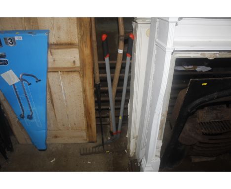 A small quantity of gardening tools to include edging shears, wooden handled scythe and a rake