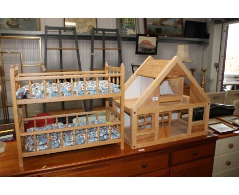 A child's dolls house and furniture together with a child's toy cot;&nbsp;a child's bar back and string seated chair