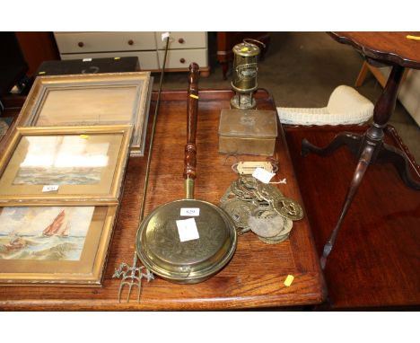 A British Coal mining lamp, a quantity of horse brasses, a brass cigarette box, a bed warming pan and a fire iron