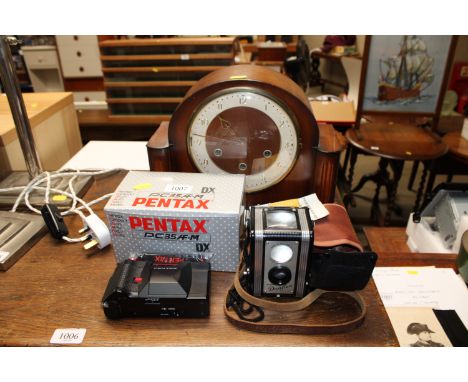 A Smiths three hole mantel clock, a Pentax camera together with a Kodak Duaflex camera