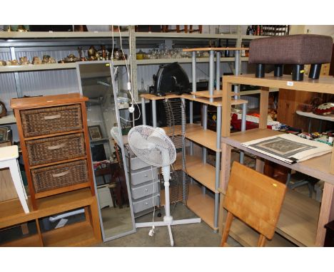 Two shelving units, a CD rack, a file tray, a standard lamp, modern cheval mirror, floor standing fan and a pedal exerciser
