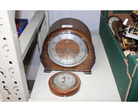 A Smiths Enfield oak cased two hole mantel clock together with a barometer 