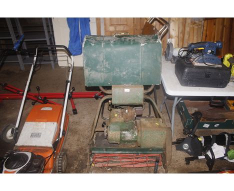 A petrol 24" cylinder lawn mower with rear roller and grass collection box 