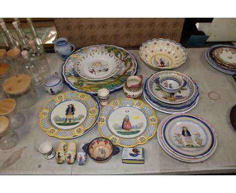 A quantity of H B Quimper pottery to include charger, bowls, jugs etc.