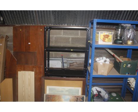 A metal four tier shelf rack